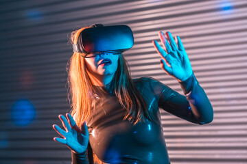 Shocked woman during an immersive game with Virtual reality goggles