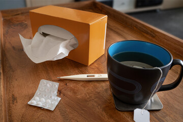 Painkillers, tea and tissues are on the table, flu, Covid19, corona, influenza