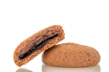 One whole chocolate chip cookie and one half, macro, isolated on white background.