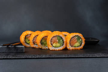 Japanese cuisine. Delicious rolls with salmon