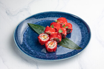 Japanese cuisine. Delicious Rolls with salmon and caviar

