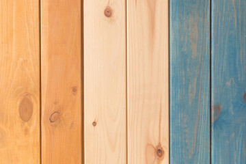 Fototapeta premium Wooden Vertical Stripes Lines Planks Colors Orange Light Brown White Blue Paint Texture Background
