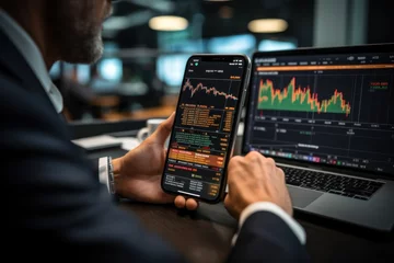 Foto op Plexiglas Crypto trader investor broker holding finger using cell phone app executing financial stock trade market trading © sirisakboakaew