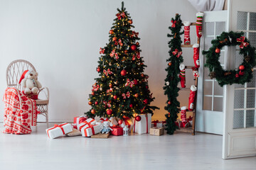 interior christmas. magic glowing tree, fireplace and gifts