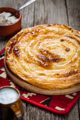 Traditional Bosnian and Turkish meal made from rolled pastry filled with spinach. In Turkey it is called Borek with cheese. In Bosnia this dish is called Pita Sirnica. Made from phyllo pastry.