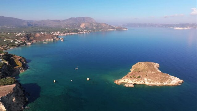 Crete, Greece. Aerial drone shot. Falassarna Beach in Chania, Elafonisi lagoon, Falassarna, Hills and town of Palaiokastro, Old christian church ruins in Crete, Katholiko Monastery greek landmark