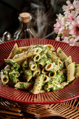 Penne pasta with spinach and chicken.
