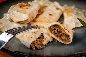 Fried dumplings stuffed with cabbage and mushrooms.