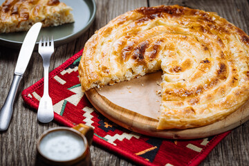 Traditional Bosnian and Turkish meal made from rolled pastry filled with spinach. In Turkey it is called Borek with cheese. In Bosnia this dish is called Pita Sirnica. Made from phyllo pastry.