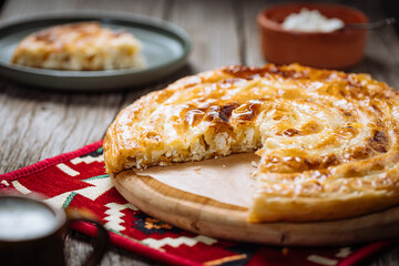 Traditional Bosnian and Turkish meal made from rolled pastry filled with spinach. In Turkey it is called Borek with cheese. In Bosnia this dish is called Pita Sirnica. Made from phyllo pastry.