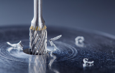 Milling cutter make sink in hole in steel billet. Locksmith work.