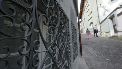 Iron metal barrier to protect windows from intruders in private property by street with people...