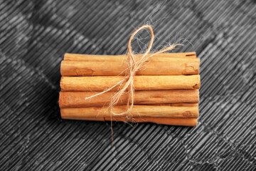Cinnamon sticks bundle with rope. Aromatic seasoning.