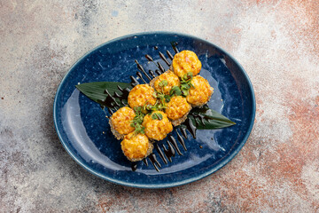 Japanese cuisine. Delicious fried rolls with salmon
