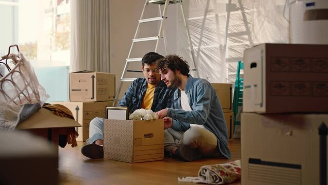 A young multi-ethnic couple of gay boys have bought a house and while they are unpacking the boxes, they find a photo, a memory that makes them laugh and excite