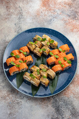 Japanese cuisine. Delicious fried rolls with salmon
