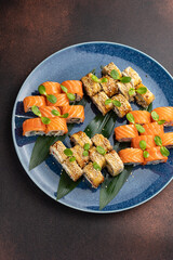 Japanese cuisine. Delicious fried rolls with salmon