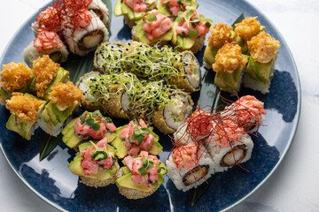 Japanese cuisine. Delicious fried rolls with salmon