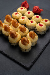 Japanese cuisine. Delicious fried rolls with salmon