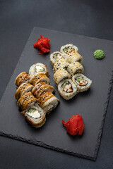 Japanese cuisine. Delicious fried rolls with salmon