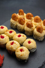 Japanese cuisine. Delicious fried rolls with salmon