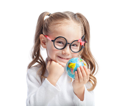 Beautiful cute little girl with glasses holding globe and smiling to the camera. Smart student studying geography with earth.  Little clever genius portrait. Save the world concept.