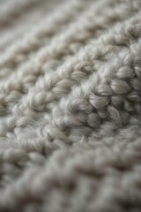 Close-up, macro photography of wool knitted products emphasizing the texture of threads and knitting