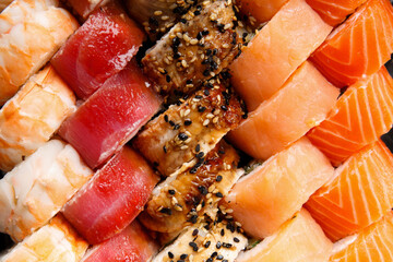 set of sushi rolls with shrimp, salmon, tuna, eel, top view, close-up © Наталья Марная