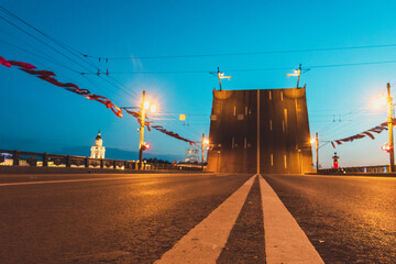 Fototapeta na wymiar View of raised Palace Bridge from road at white night. Saint Petersburg. Russia