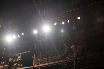 row of theater spotlights above the stage