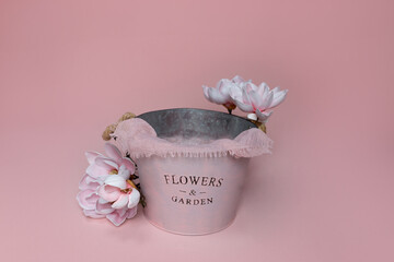 background texture for newborns. the bucket is decorated with flowers. magnolia flowers. first photo session for a newborn. decor