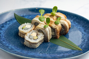 Japanese cuisine. Handmade sushi rolls with eel