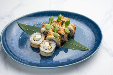 Japanese cuisine. Handmade sushi rolls with eel