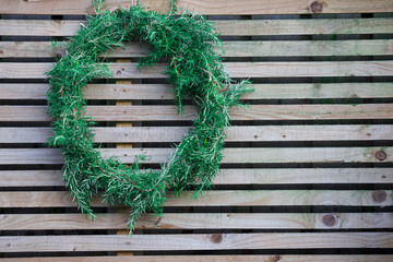 Natural wreath on wooden fence