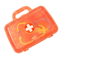 A faded plastic toy doctor's case and set shot isolated on a white background with copy space...