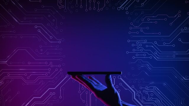 A hand holding smartphone on the PCB printed circuit board background. Mobile application or innovation smart phone app. Motherboard digital abstract background. Free copy space for name or logo text