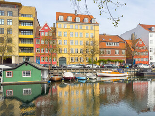 Walking along Nyhamn's canals in Copenhagen, with old colorful buildings, Denmark