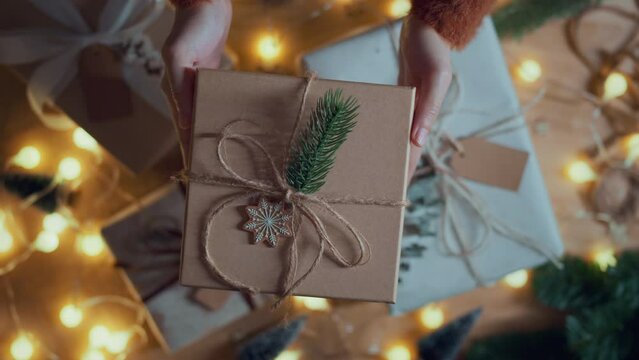 Hands of woman gives a Christmas gift box, Congrats, Happy New Year, Merry Christmas, presents gifts