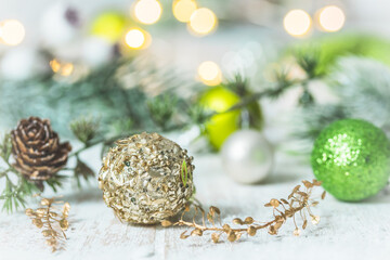 Various christmas ornaments on a white wooden background
