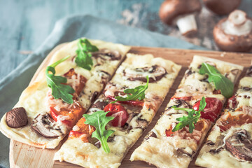 Freshly baked flammkuchen, traditional french tarte flambee or german pizza in a vegetarian recipe...