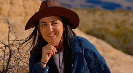 Close up shot of a young woman in a western style outfit in the Arizona desert - travel photography