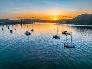 Early morning sunrise views at the waterfront where the water meets the sea