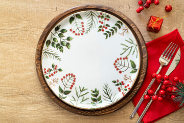 Christmas table setting, with Christmas decorations. Top view, copyspace.