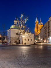 Main market square and St Mary's church in the night, Krakow, Poland.
