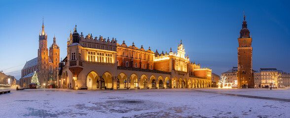 Krakow, Poland, main square night panorama with Cloth Hall and St Mary's church.