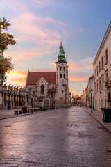 Fototapeta na wymiar Krakow old town, romanesque St Andrew church on Grodzka street during colorful sunrise