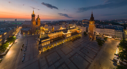 Krakow, Poland, main square night panorama from the air with Cloth Hall and St Mary's church - obrazy, fototapety, plakaty