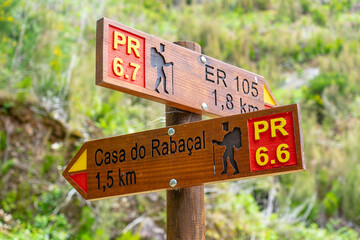 direction signs for hiking trails PR 6.7, ER105,1,8Km.  PR 6.6, Rabaçal house, 1.5 km from Madeira Island