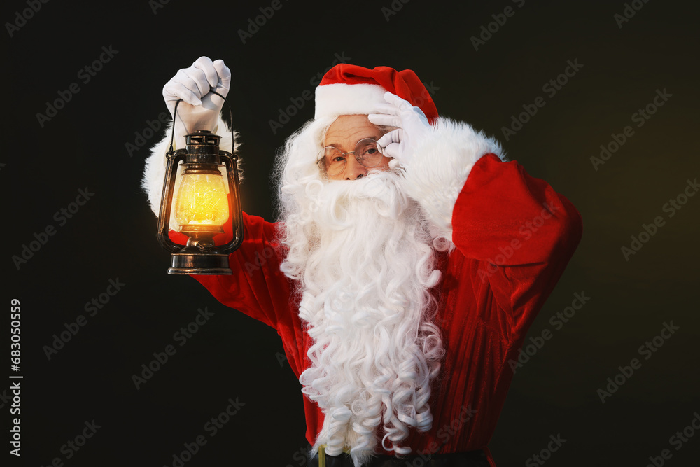 Sticker Merry Christmas. Santa Claus with vintage lantern on dark background