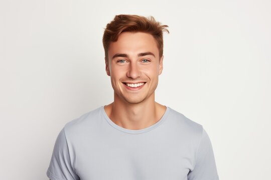 Handsome Fictional Male Model with Blue Eyes Smiling Candidly. Casual Clothes. Isolated on a Plain White Background. Generative AI.